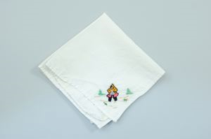 Image of Figure jumping rope, one of a set of 3 embroidered napkins with scenes of Inuit girls playing